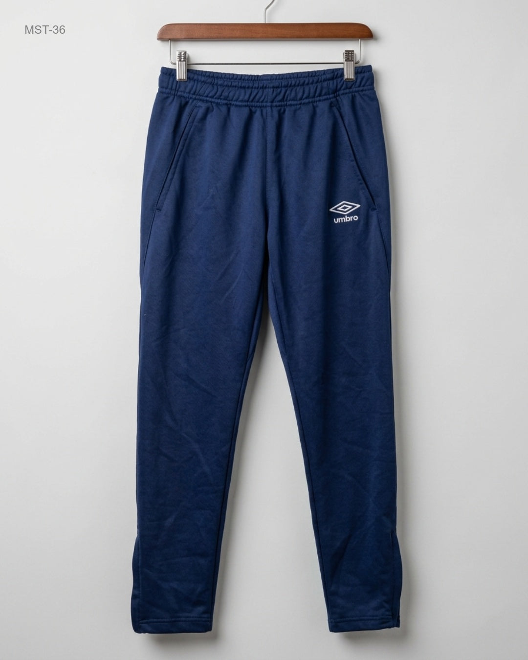 Shop Premium Men Sports Trousers by Umbro | Preloved Branded Clothes | Blue Polyester | MENS | OTS Thrift Store Peshawar Pakistan